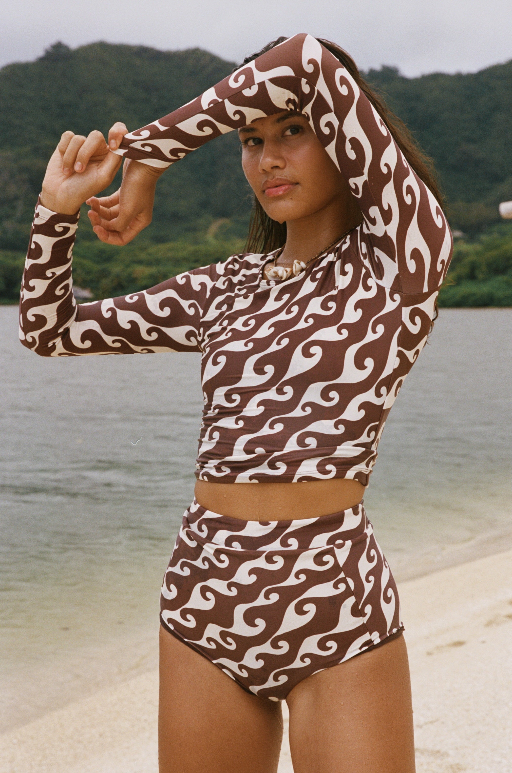 The Poppler is our new long sleeve cropped rash guard top. A second-skin, full-coverage silhouette that is perfect for roaming the ocean while being protected from the sun.
