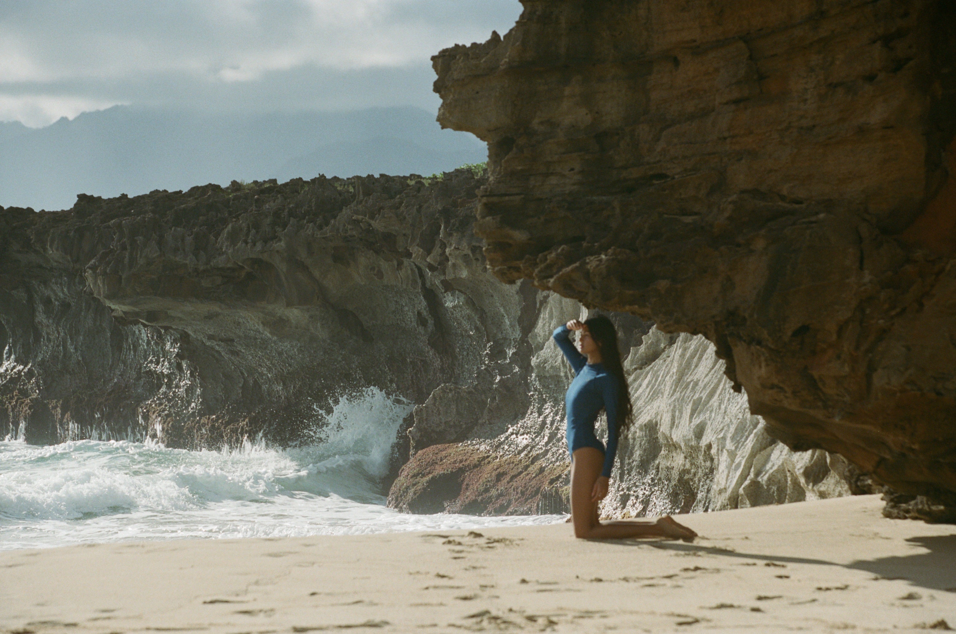The Ama Surf suit Dune-Rib made with recycled plastic bottles into recycled fibers,  features a full covered back combined with a back zipper.