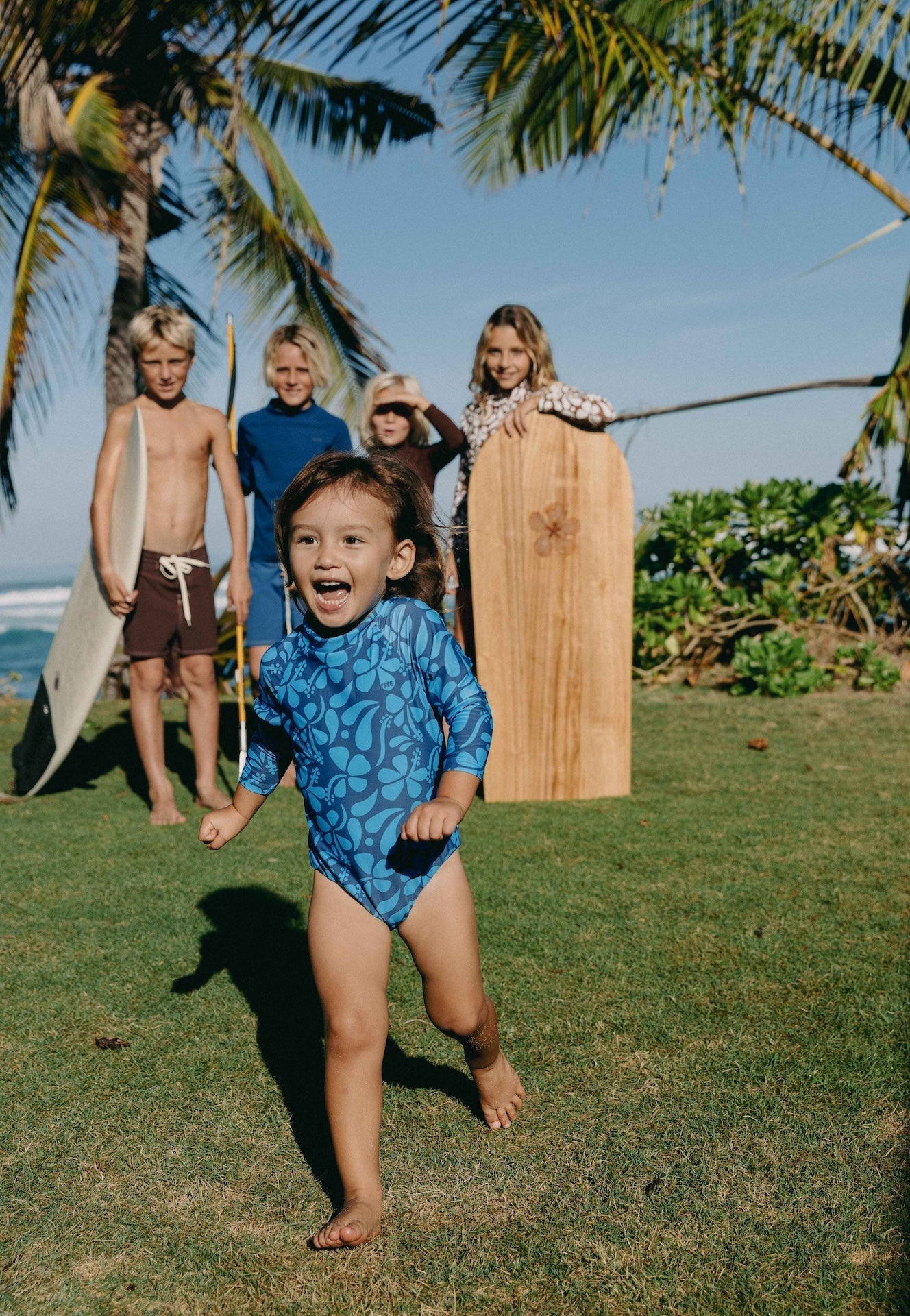 Introducing the Mini Ama Surf suit, a long sleeve one-piece swimwear, made to protect your little ones from the sun during long days at the beach