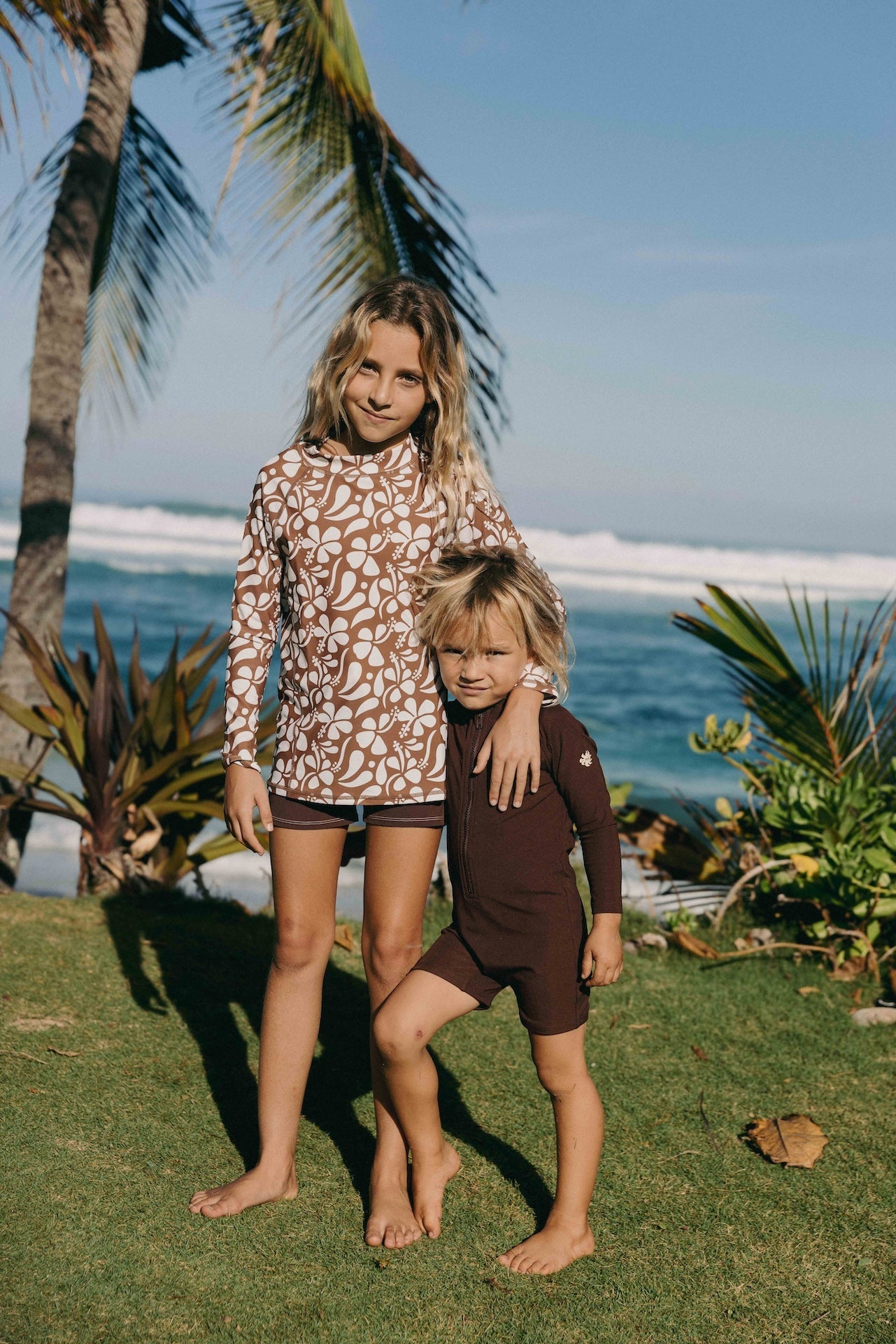 Introducing the Mini Dekker Surf suit, a long sleeve one-piece rash guard, with boy cut shortie bottom