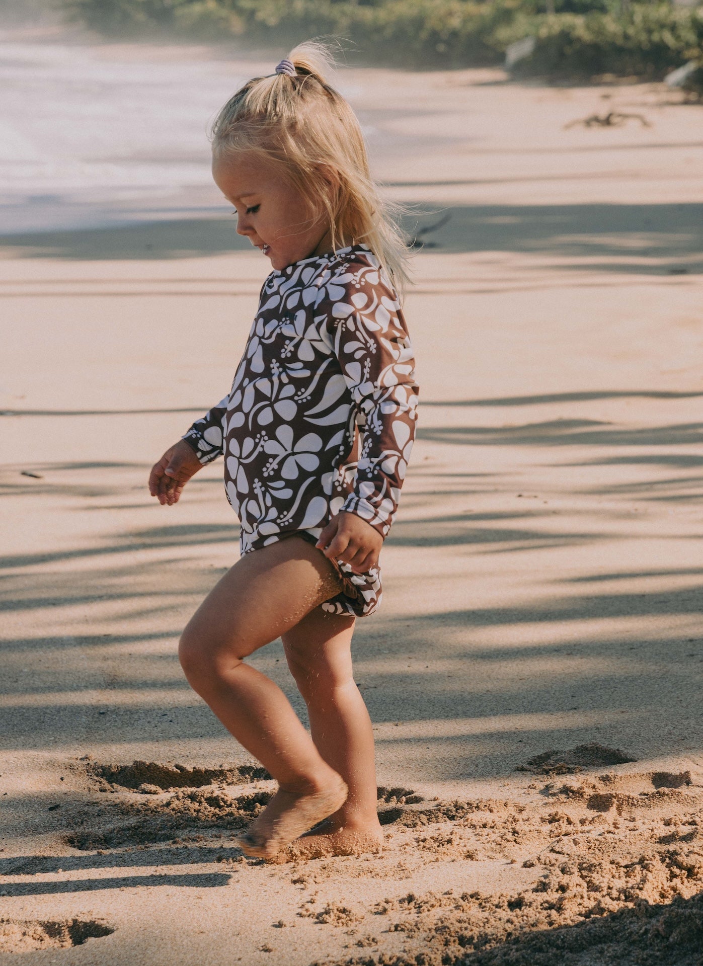 Introducing the Mini Ama Surf suit, a long sleeve one-piece swimwear, made to protect your little ones from the sun during long days at the beach