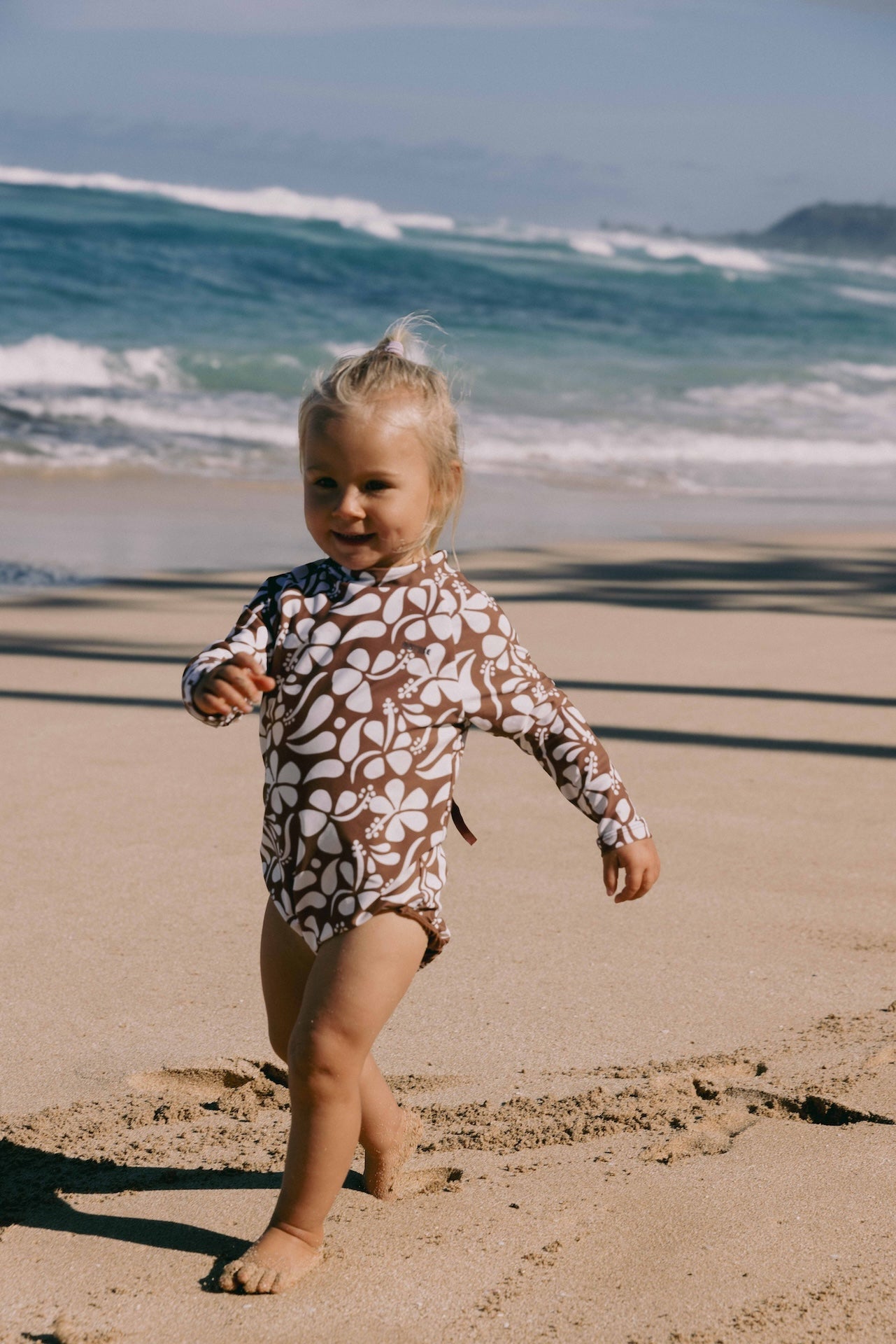 Introducing the Mini Ama Surf suit, a long sleeve one-piece swimwear, made to protect your little ones from the sun during long days at the beach