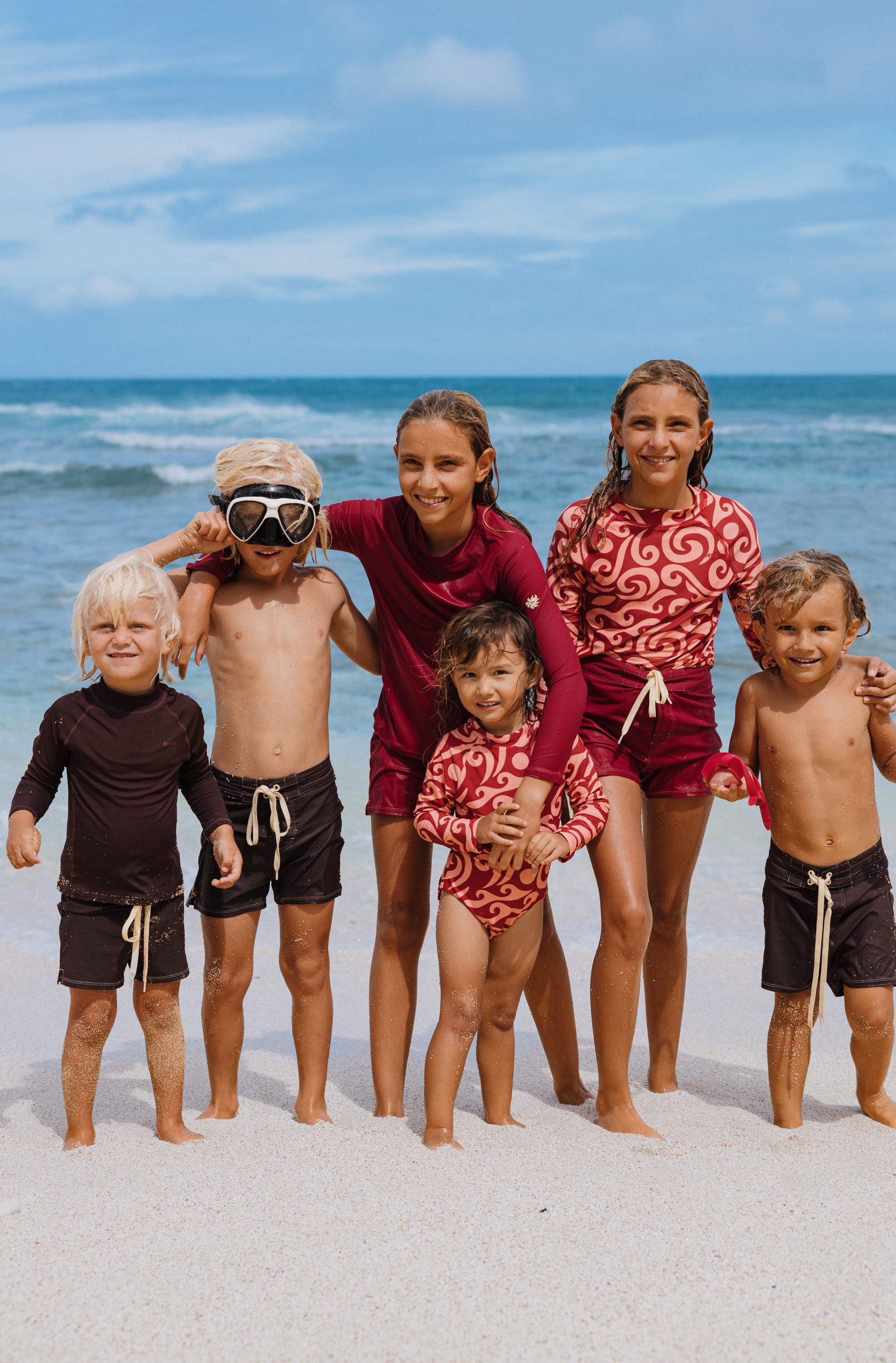 kid in a sustainable wetsuit