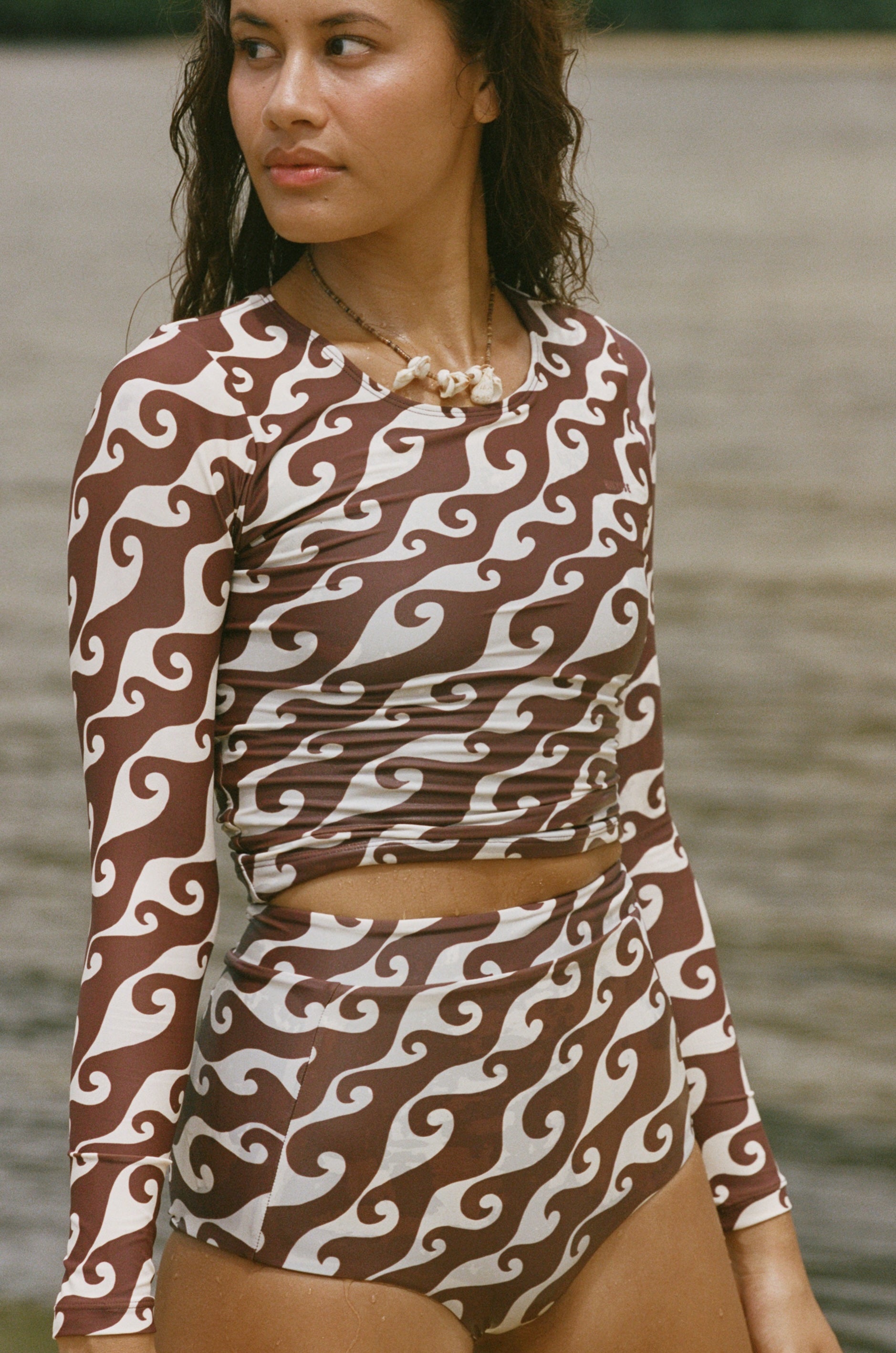 The Poppler is our new long sleeve cropped rash guard top. A second-skin, full-coverage silhouette that is perfect for roaming the ocean while being protected from the sun.