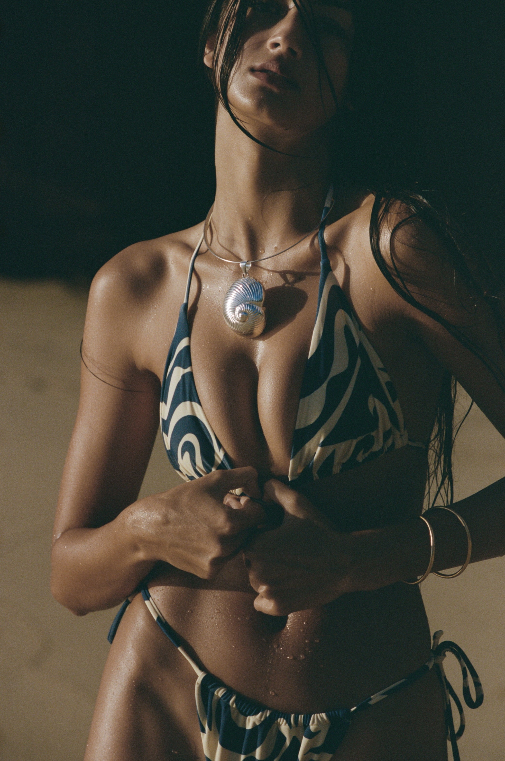 The Maya is a classic triangle top, attached via a neck and back bow tie. The bust cups have a ruched aesthetic look but are also adjustable to your body.